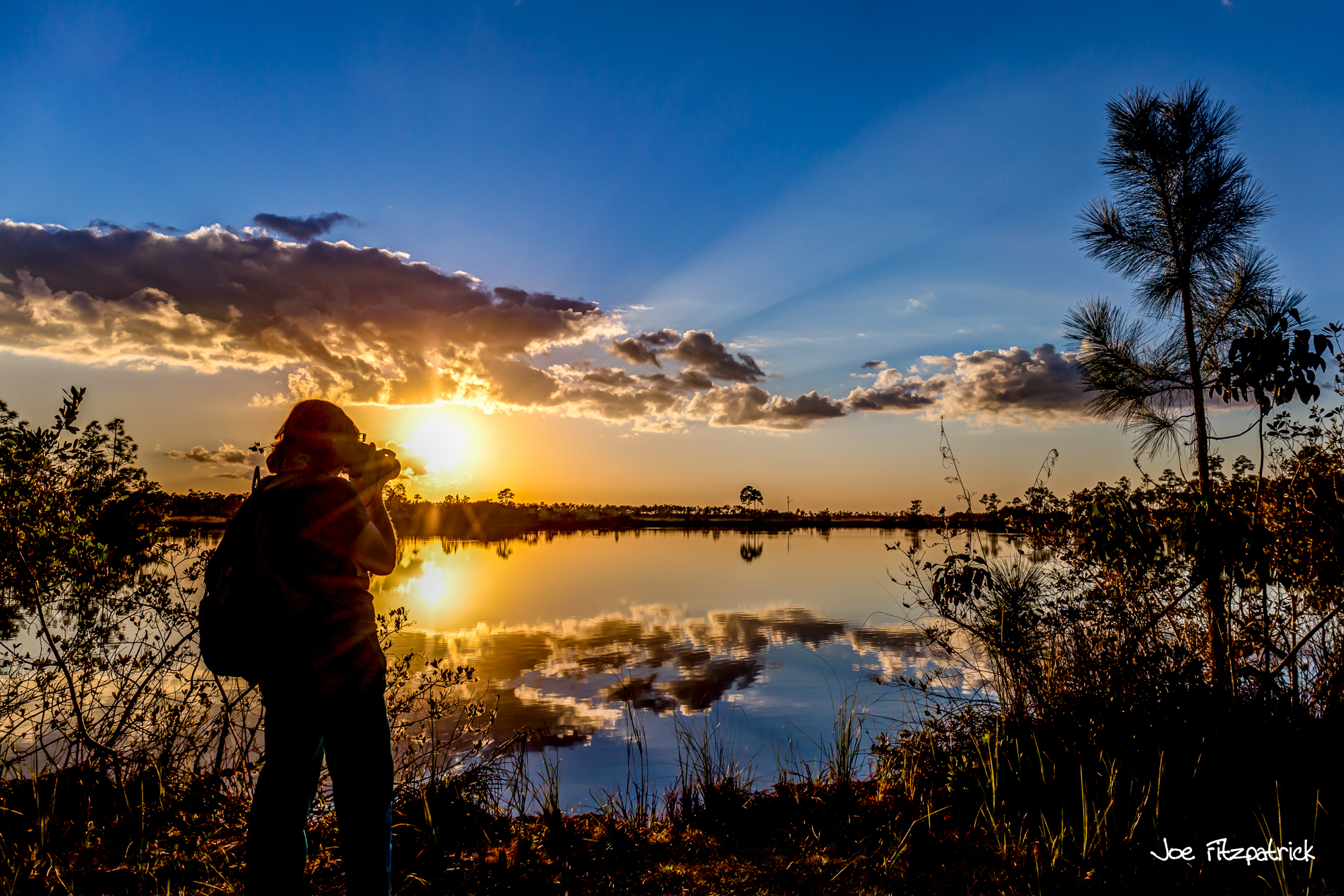 photographer taking picture of sunset, sunset, photography workshop, fisheye connect