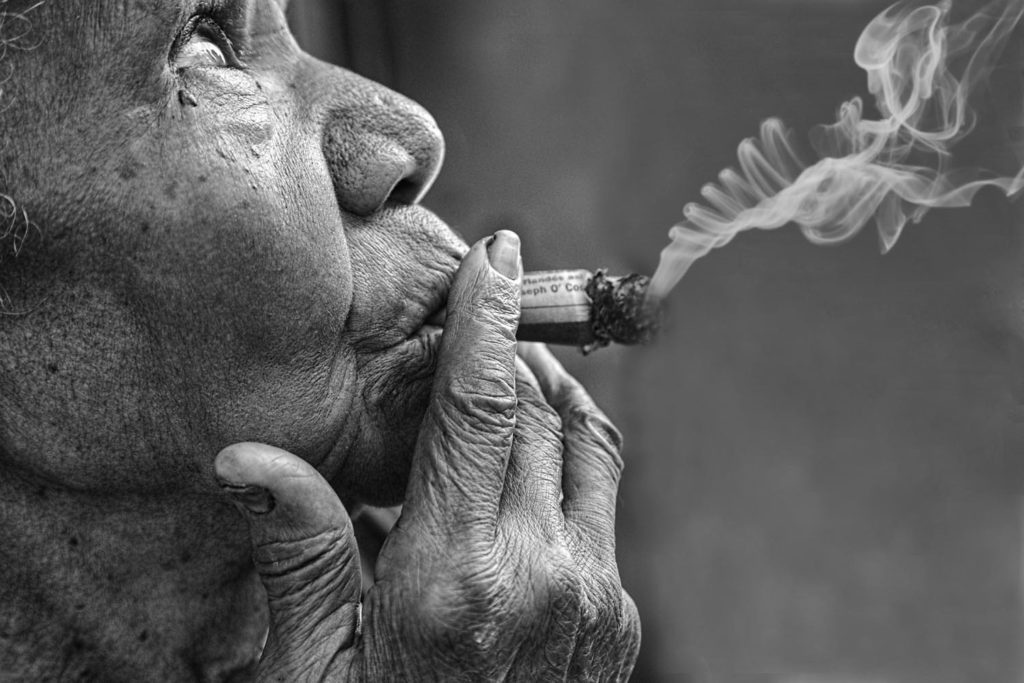 A woman smoking a cigar, Mary Buck, Cuba, Photography Workshops, Photograph Cuba,  Fisheye Connect, Black and White Photography, Photography Tour